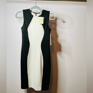 Brand new with tags. Black and white with light pink trim. Size 4.